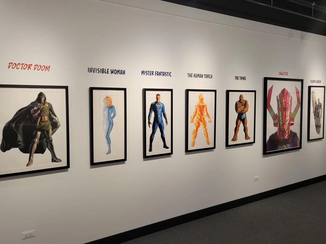Framed life-size character portraits from the exhibition